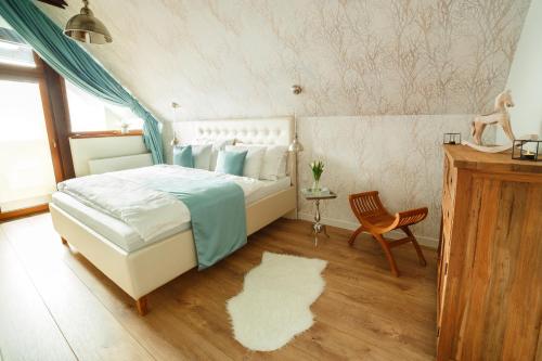 מיטה או מיטות בחדר ב-Horvát Family Residence