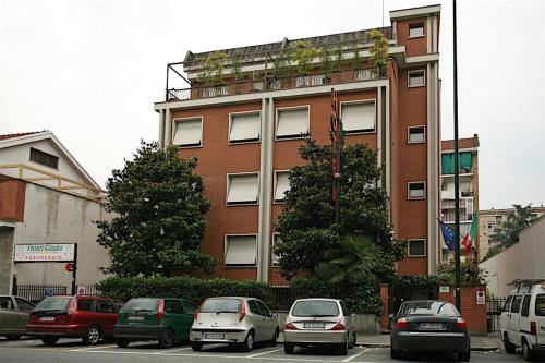 a group of cars parked in front of a building at Hotel Giada in Turin