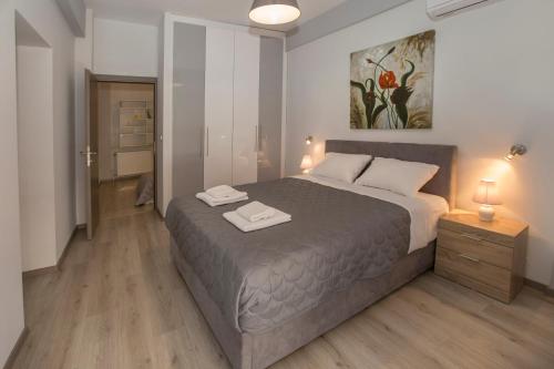 A bed or beds in a room at Acropolis Gem by GHH