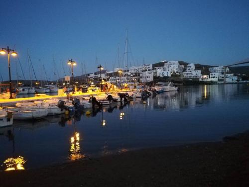 a group of boats docked in a marina at night at Enjoy Cyclades studios & suites in Kithnos