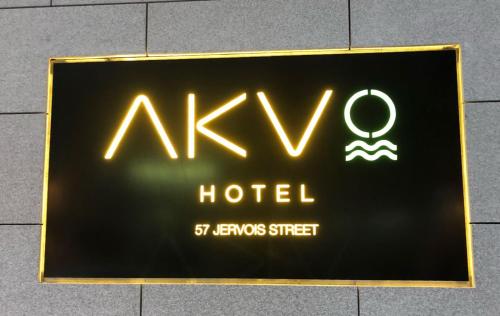 a sign that is on the side of a building at AKVO Hotel in Hong Kong