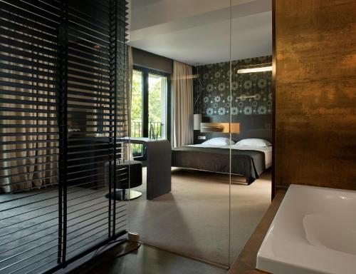 Postel nebo postele na pokoji v ubytování mOdus Hotel