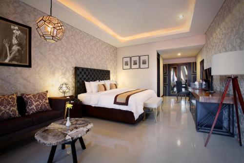 Кровать или кровати в номере The Visala Boutique Suites Seminyak