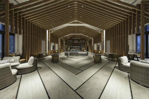 a rendering of a lobby with couches and tables at Angsana Zhuhai Phoenix Bay in Zhuhai