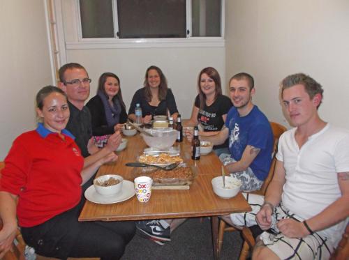 a group of people sitting around a table at Dolphin Retreat Bunbury in Bunbury