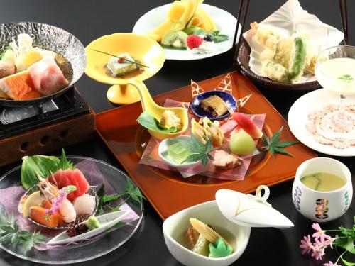 a table topped with different types of food at Lakeland Hotel Mizunosato in Fujikawaguchiko