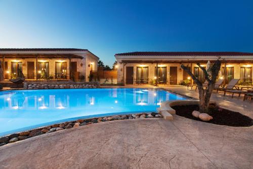 a swimming pool in the middle of a house at Casa Afytos - Adults Only in Afitos