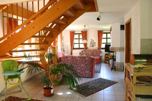 a living room with a staircase and a living room at Ferienwohnung Erzgebirge in Pockau