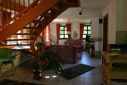 a living room with a staircase and a living room at Ferienwohnung Erzgebirge in Pockau