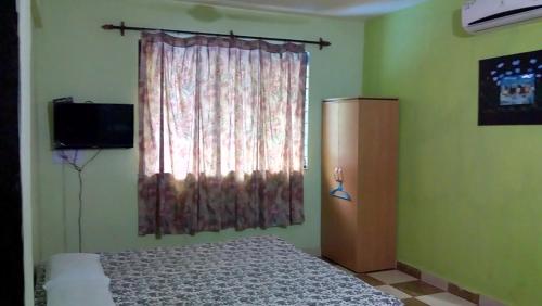 TV a/nebo společenská místnost v ubytování Aguiar Guest House