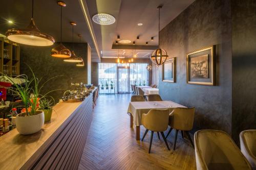 a dining room with a table and chairs at Hotel Bigeste in Ljubuški