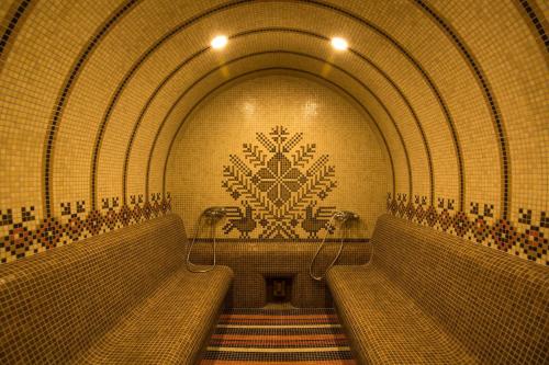 a tunnel with two benches in a subway at Zaara Estate Winery Hotel & SPA in Glavan