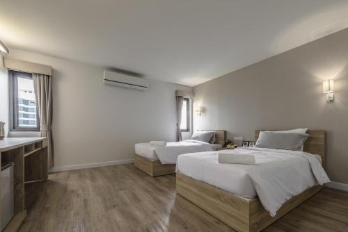 Llit o llits en una habitació de Carnation Residence