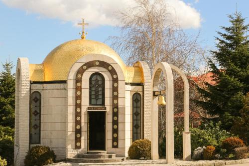 a church with a cross on top of it at Tsarsko Selo Spa Hotel in Sofia