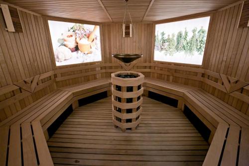 a inside of a wooden sauna with two windows at Royal Grand Hotel and Spa - All Inclusive and Free beach accsess in Kavarna