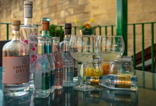 a group of wine bottles and glasses on a table at Garrison Hotel in Sheffield