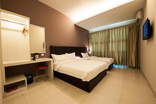 Postel nebo postele na pokoji v ubytování Seven Hotel