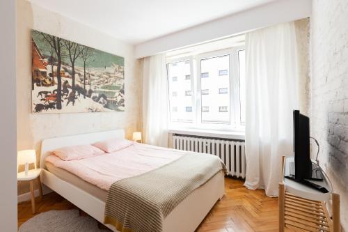Katil atau katil-katil dalam bilik di Apartament w sercu miasta