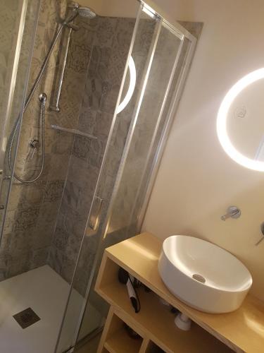 a bathroom with a shower and a sink at Villetta Volta in Rapallo