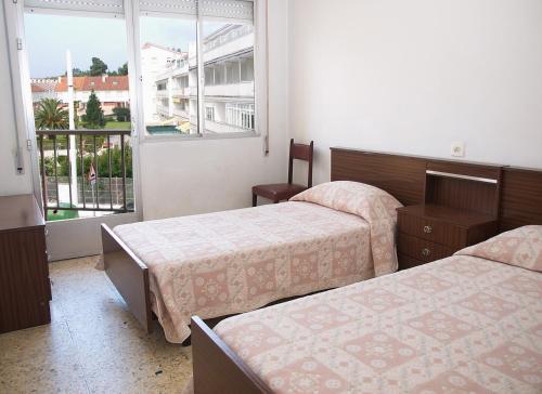 Ένα ή περισσότερα κρεβάτια σε δωμάτιο στο Apartamentos Vacacionales Caracas