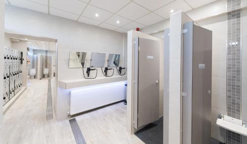 a bathroom with a sink and a shower stall at The Barnstaple Hotel in Barnstaple