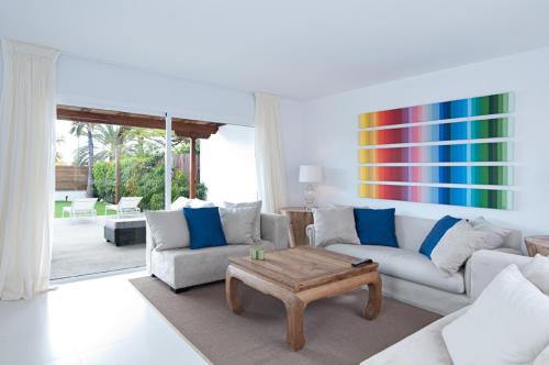 a living room with a couch and a coffee table at Villas Pasito Blanco in Pasito Blanco