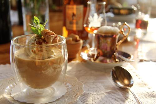 a table with a cup of dessert on a table at Hotel & Spezialitätenrestaurant zur Linde in Teufen