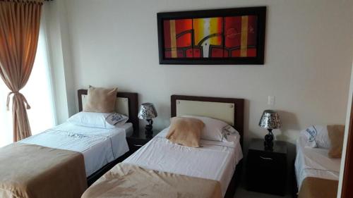 A bed or beds in a room at Hotel la fuente j.n