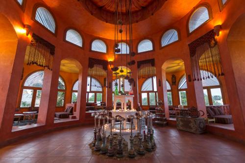 a large building with a large room with windows at Africa Jade Thalasso in Korba