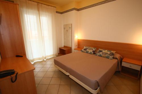 Postel nebo postele na pokoji v ubytování Hotel Boom