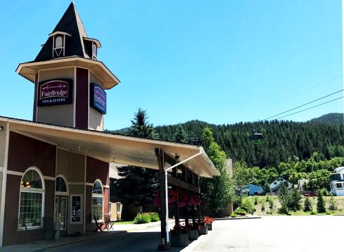 a building with a clock tower on top of it at FairBridge Inn & Suites Kellogg in Kellogg
