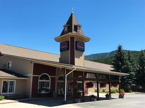 a building with a clock tower on top of it at FairBridge Inn & Suites Kellogg in Kellogg