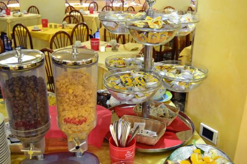 a group of glasses filled with food on a table at Hotel Ettoral in Lido di Jesolo