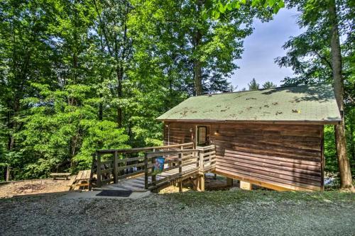 a log cabin with a wooden ramp leading to it at Nantahala Cabins in Bryson City