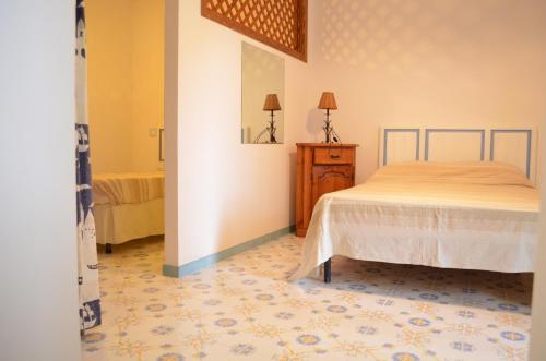 Llit o llits en una habitació de Villa La Gioiosa