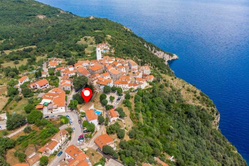 an aerial view of a village on a hill by the water at Villa Chiara in Brseč