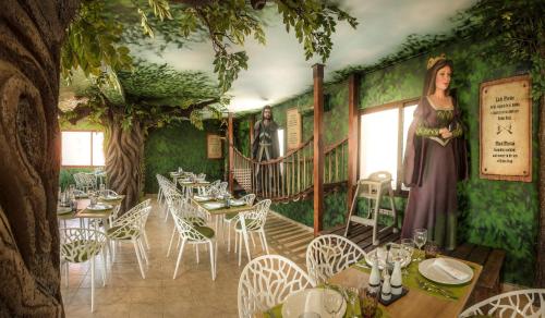 a rendering of a restaurant with tables and chairs at Magic Robin Hood in Albir