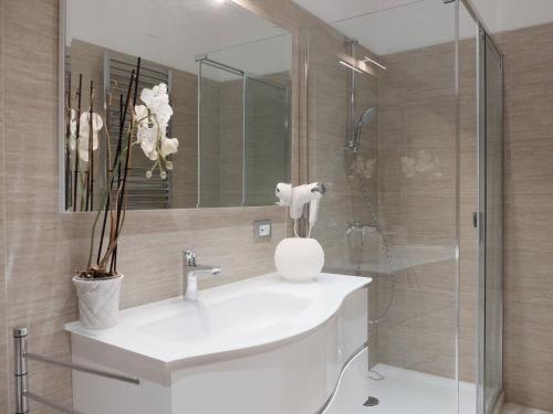 a bathroom with a sink and a shower at Centro Storico Suites in Ferrara