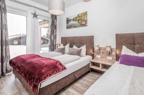 Ένα ή περισσότερα κρεβάτια σε δωμάτιο στο Chaletdorf-Fanningberg