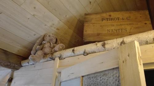 a wooden pole on the ceiling of a building at Villa Étienne in Le Mont-Dore