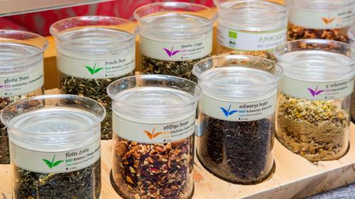 a group of jars filled with different types of seeds at Hotel St. Florian in Frauenau