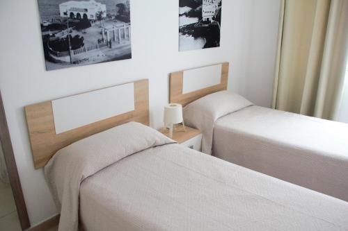 Postel nebo postele na pokoji v ubytování Apartamentos Tao Laia