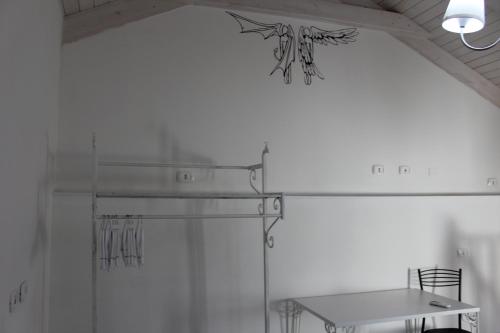 a white room with a table and a ceiling at Angels'Home A 'n D in Pizzo