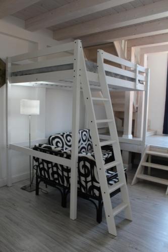 a white bunk bed with a desk and a ladder at Angels'Home A 'n D in Pizzo