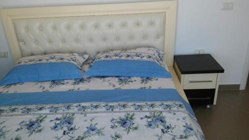 מיטה או מיטות בחדר ב-Bougainvill Sunset Villa