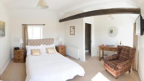 Кровать или кровати в номере Deighton Lodge