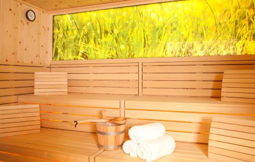 a sauna with two rolls of towels in it at Hotel St. Florian in Frauenau