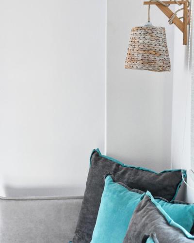 a room with two pillows and a lamp at Angelos Boutique Suites in Patitiri