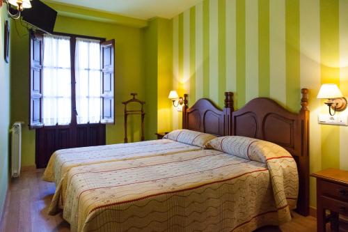En eller flere senge i et værelse på Hosteria Hijuelas