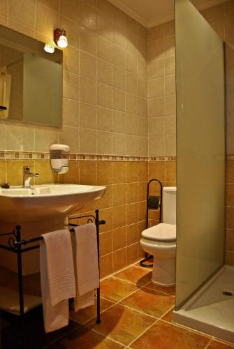 a bathroom with a sink and a toilet at Casa Rural GAUBEKA in Bakio
